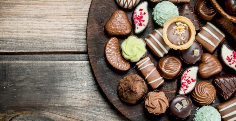 Chocolate sweets on a wooden Board.